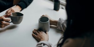People talking over coffee.
